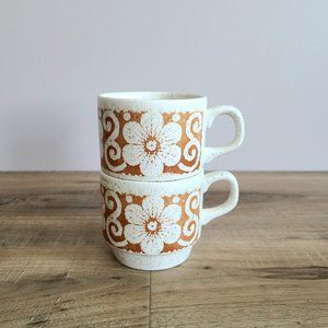 Vintage set of 2 Biltons stackable speckled mugs with light brown floral design.